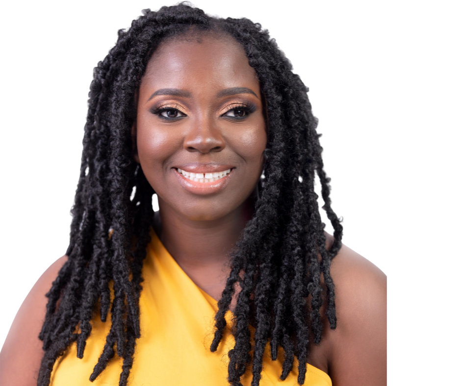 A woman with dreadlocks wearing an orange dress.